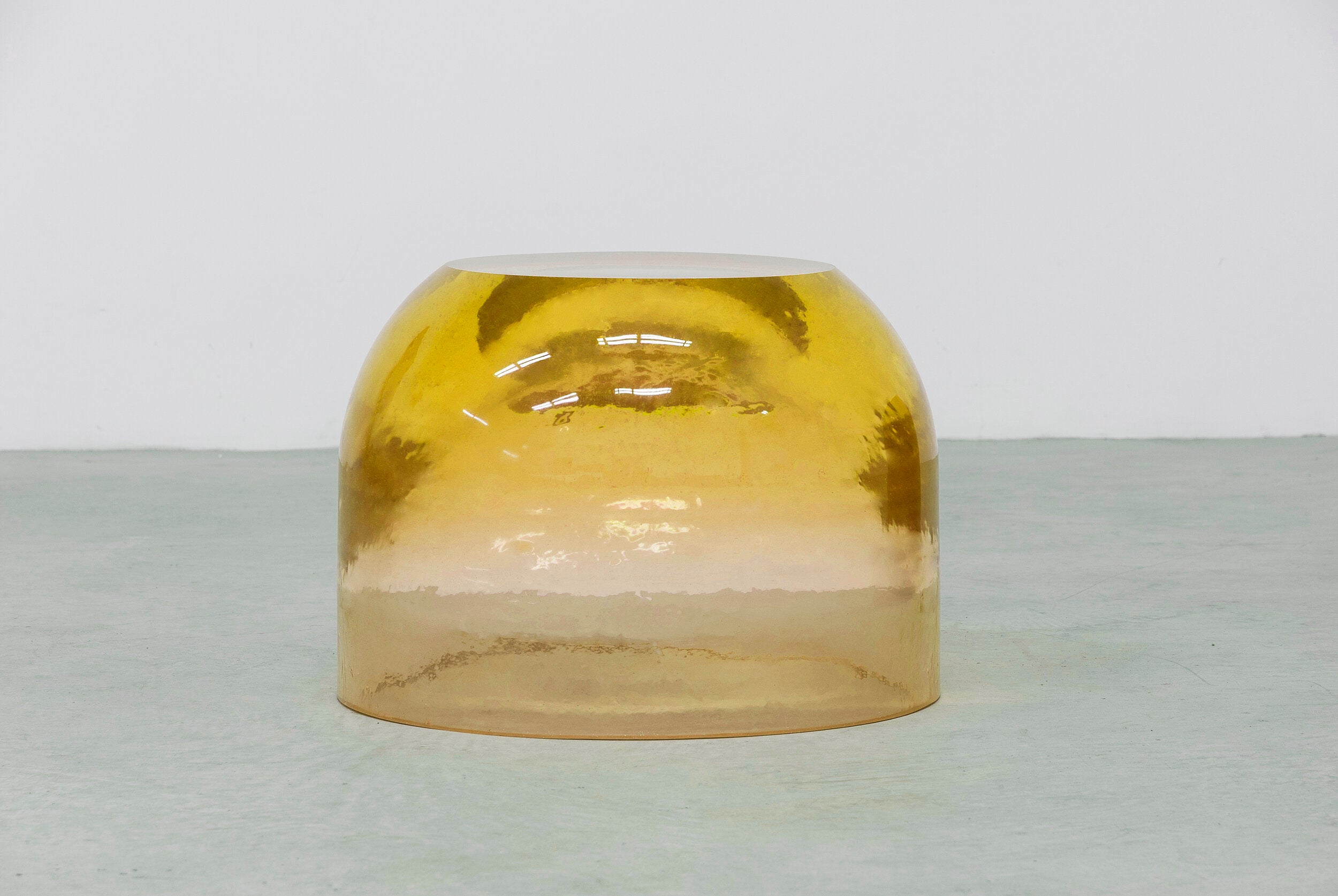 Chic and playful side table or transparent resin stool by artist Ian Alistair Cochran. Available through collectible design gallery Tuleste Factory in New York City.