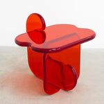 Front view of unique contemporary and playful transparent side table in resin by Ian Alistair Cochran. Represented by collectible design gallery Tuleste Factory in Chelsea, NYC.