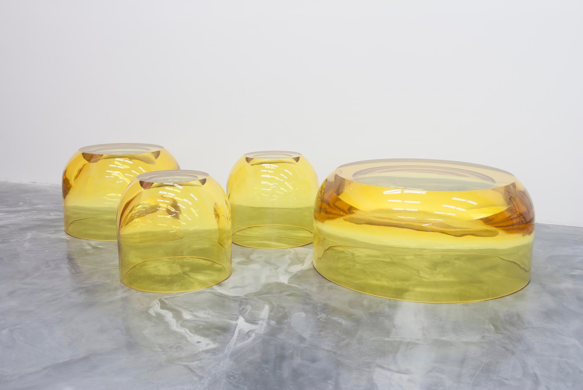 Chic and playful side table or transparent resin stool by artist Ian Alistair Cochran. Available through collectible design gallery Tuleste Factory in New York City.