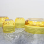 Chic and playful side table or transparent resin stool by artist Ian Alistair Cochran. Available through collectible design gallery Tuleste Factory in New York City.