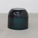 Close up detail of chic and playful side table or transparent resin stool by artist Ian Alistair Cochran. Available through collectible design gallery Tuleste Factory in New York City.