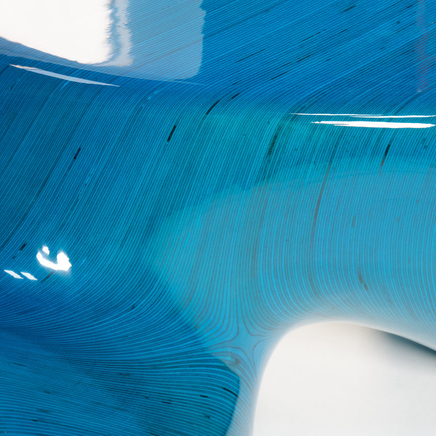 Detail of the sculptural birch plywood bench, overlaid in epoxy resin, by Ezra Ardolino, Timbur. Represented by Tuleste Factory, an art & design gallery in Chelsea, New York city.