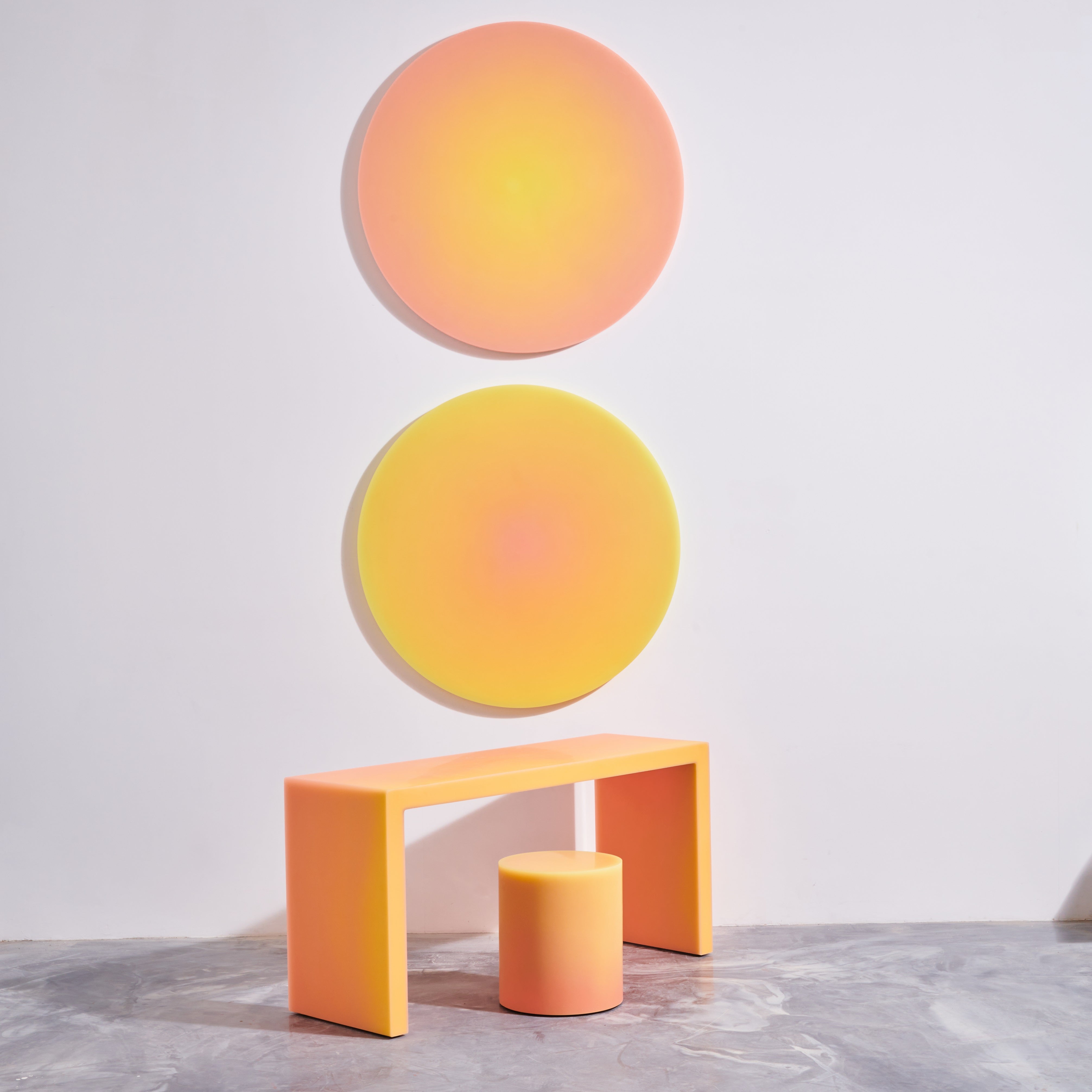 Colorful resin stool and side table is beige and coral by designer Facture. Available through fine art and design gallery Tuleste Factory in New York City.