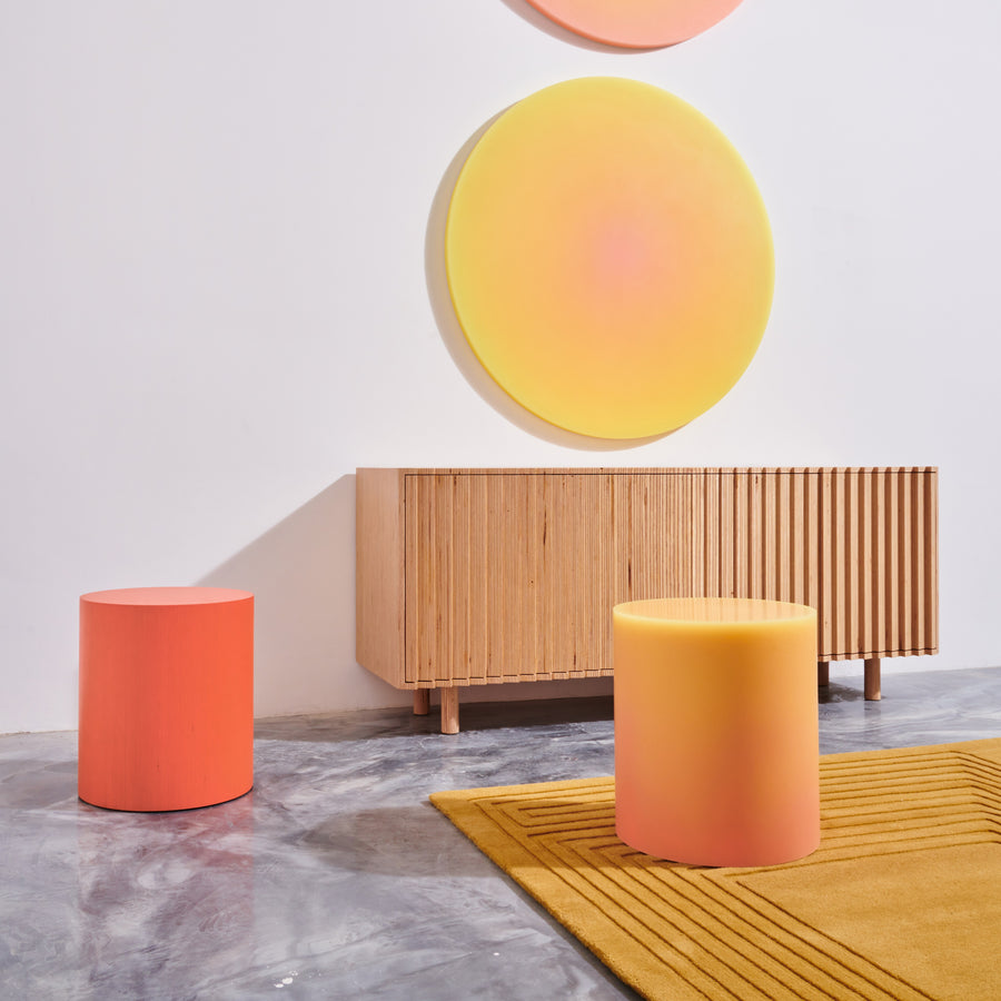 Colorful resin stool and side table is beige and coral by designer Facture. Available through fine art and design gallery Tuleste Factory in New York City.