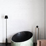 The Plane side table by Bailey Fontaine is hand sculpted from cement. On display at Tuleste Factory, a non-traditional gallery in New York City.