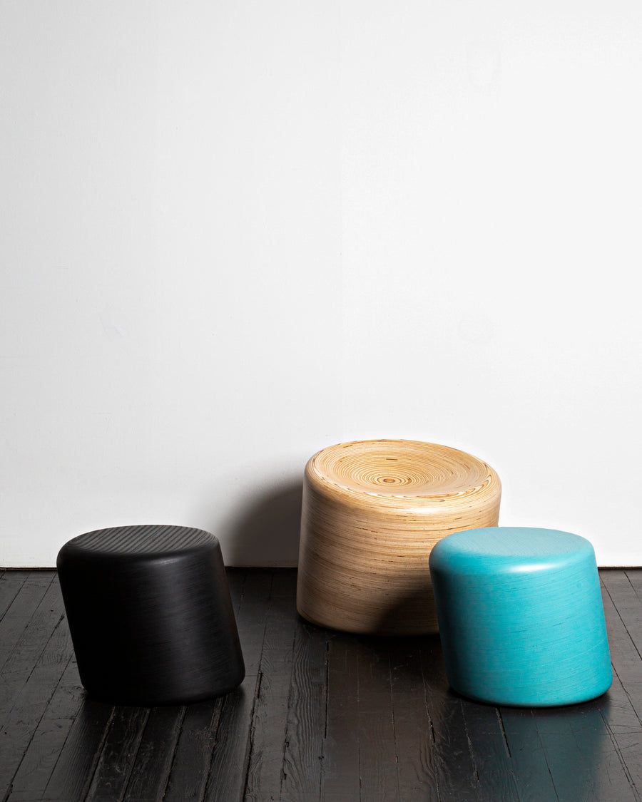 Two stack stool and a stack seat by design and fabrication studio, Timbur on display at Tuleste Factory, a non-traditional art gallery in New York City.