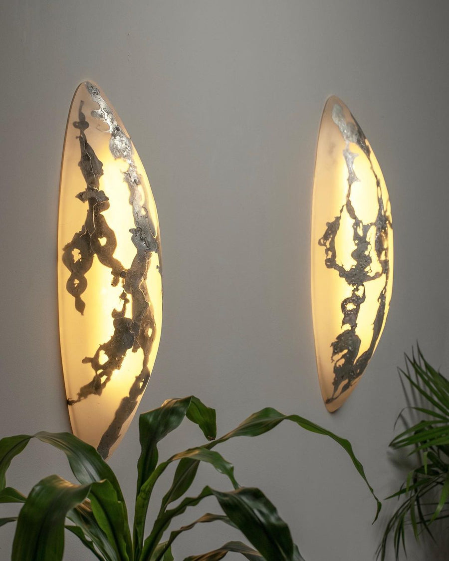 Two pearl sconces by Amanda Richards studio switched on. These wall light double as sculpture. Represented by design gallery, Tuleste Factory in New York City.