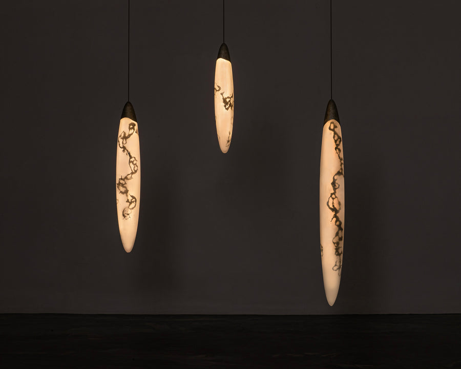 Small, medium, and large pearl pednat lights by artist and designer Amanda Richards. These hanging lights function as light and sculpture. Made from recycled materials. Represented by Tuleste Factory in New York City.