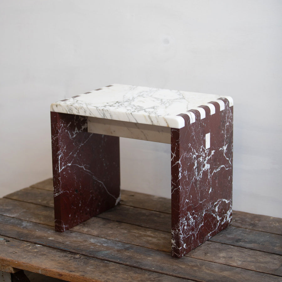 Brown and white marble side table and stool handcrafted by artist Chris Miano. Represented by collectible design gallery Tuleste Factory in New York City.