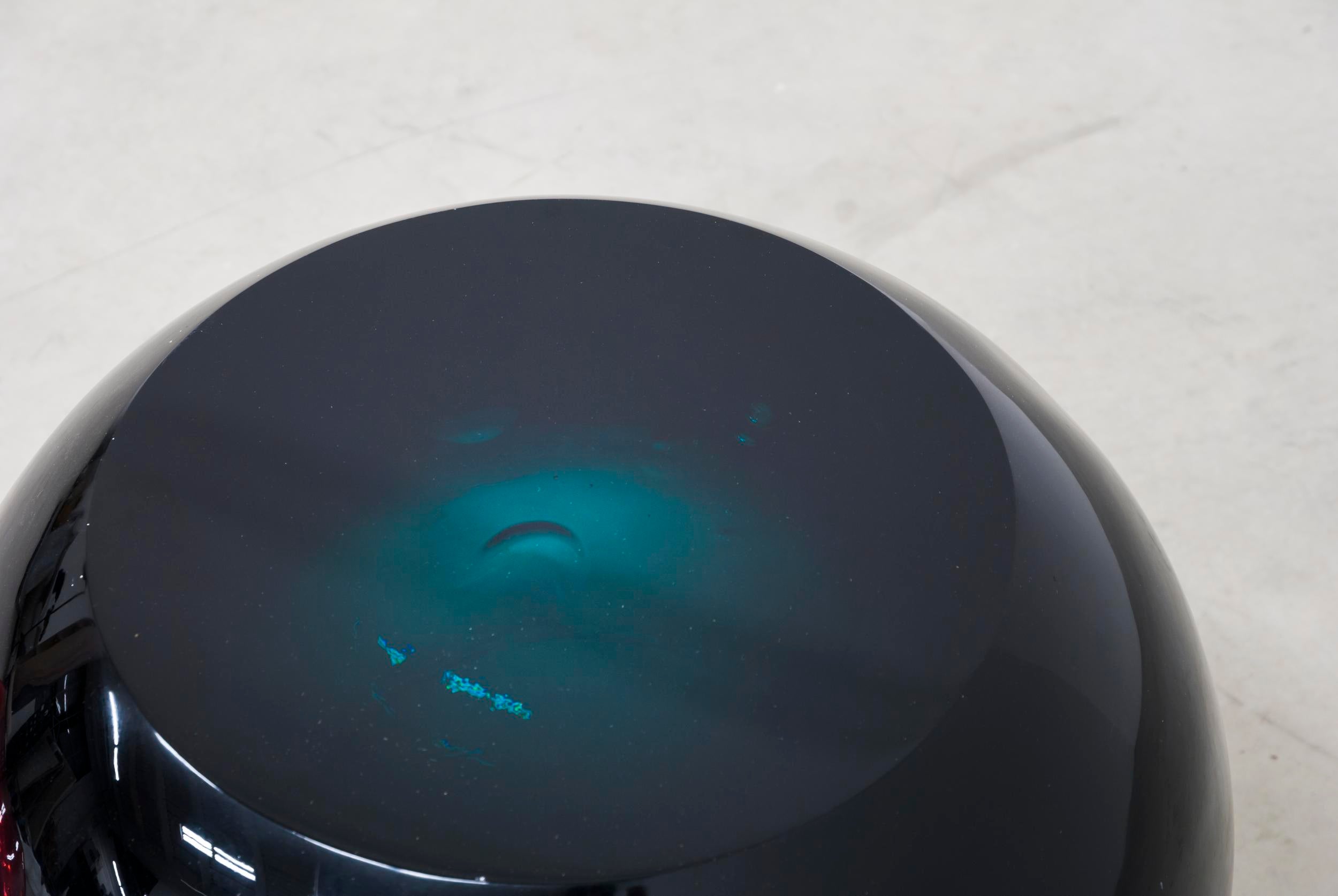 Close up detail of chic and playful side table or transparent resin stool by artist Ian Alistair Cochran. Available through Tuleste Factory in New York City.