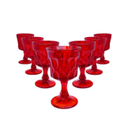 Vintage set of 7 red glasses with oval indentations decorating the outer layer sold by Tuleste Factory, an art and design gallery in Chelsea, NYC.