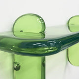 Close up detail of unique contemporary transparent resin shelving console by artist Ian Alistair Cochran. Available through collectible design gallery Tuleste Factory in Chelsea, NYC.