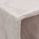 Close up detail of minimalist hand sculpted art side table by artist Bailey Fontaine. Represented by design gallery Tuleste Factory in New York City.
