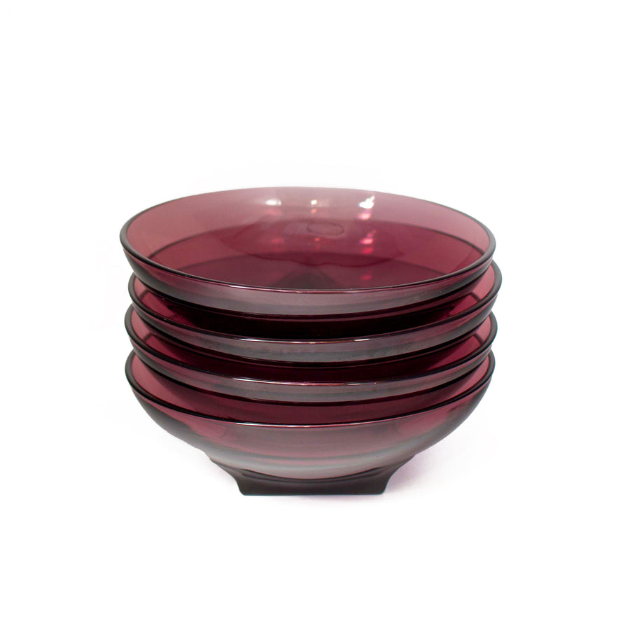 Vintage purple bowls. The color radiance changes saturation from dark purple to a lighter tone. The squared bottom of the dish opens up to a circled bowl.