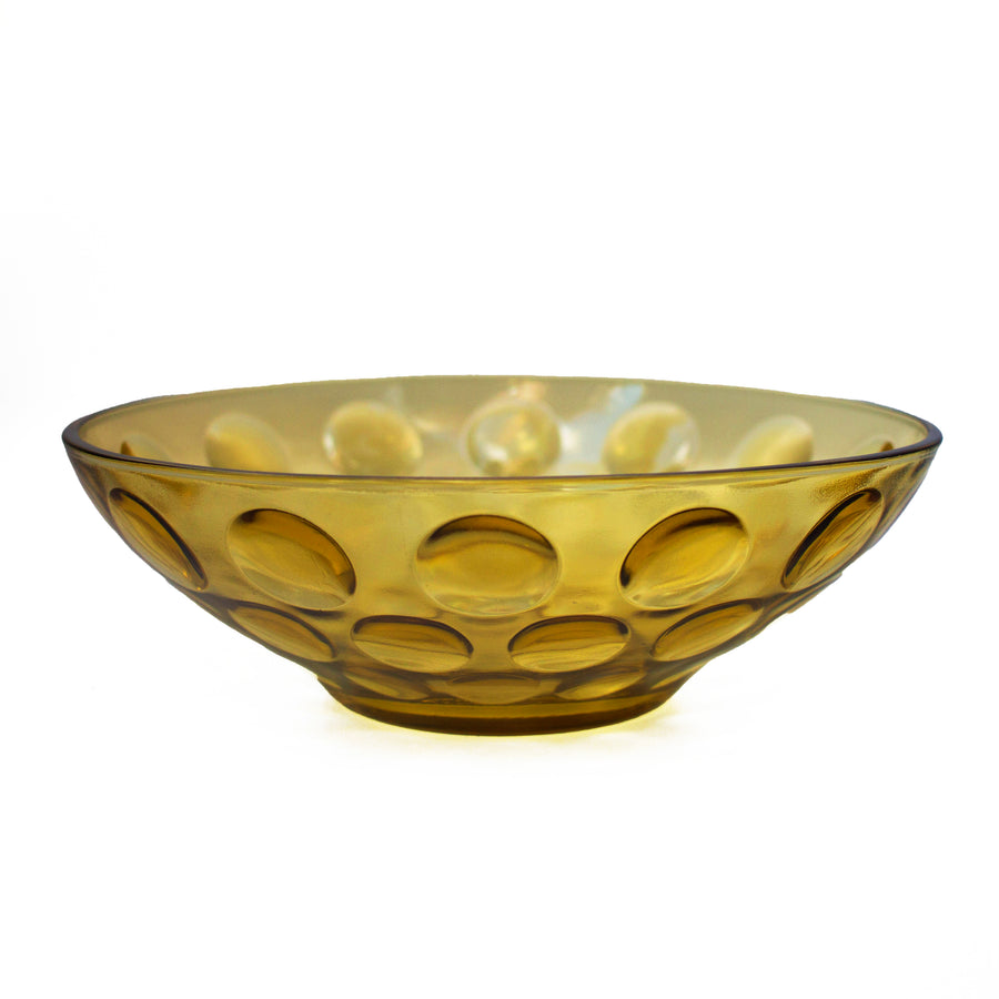 Yellow crystal bowl with circle indentations decorating the outer layer. Perfect for holding fruits, salads, or just a centerpiece decoration.